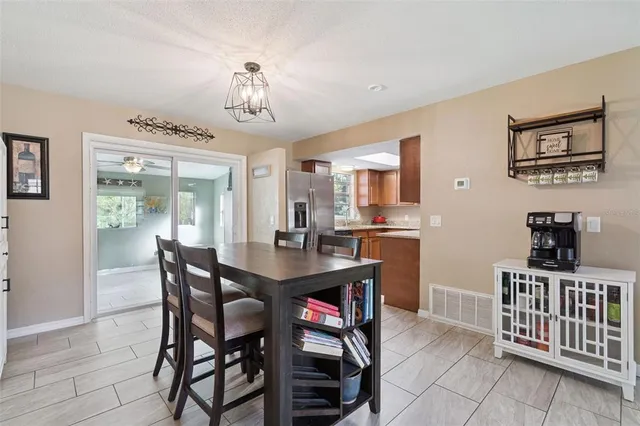 a kitchen with a sink stove top oven and cabinets