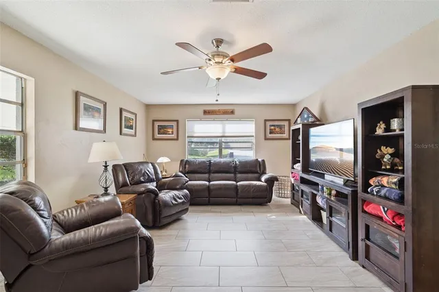 a bedroom with a bed dresser and a window