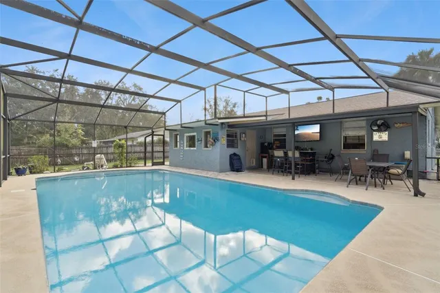 a view of a swimming pool with a patio