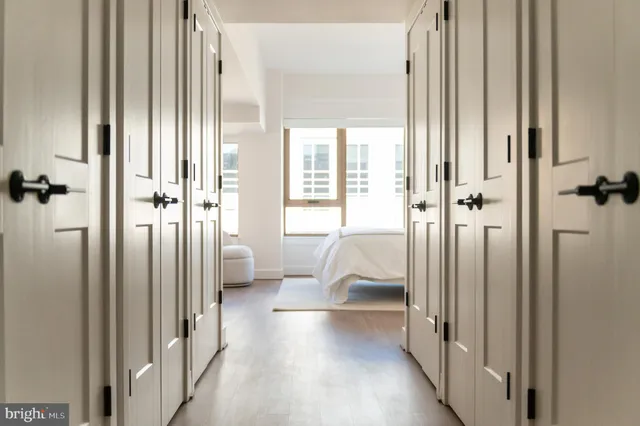 a lobby with furniture and floor to ceiling window