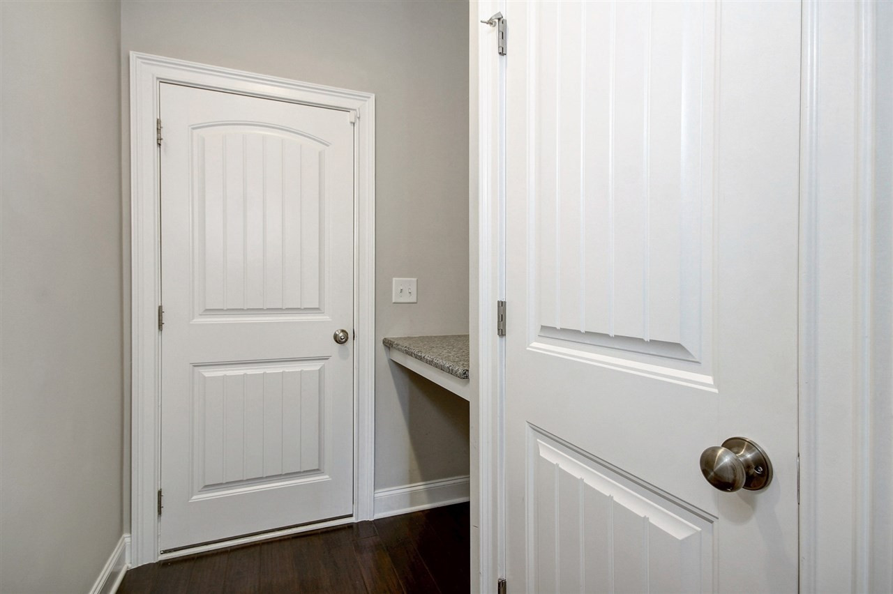 8209 Pritchett Farm Lane Raleigh, NC 27606 - Photo 22 of 30 GARAGE ENTRY GRANITE COUNTER
