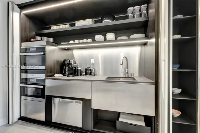 a kitchen with a refrigerator and cabinets