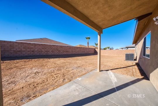327 Abigail Street Ridgecrest, CA 93555 - Photo 30 of 35 a view of a house with a yard