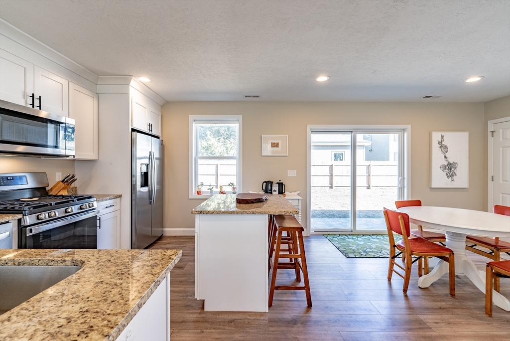 20 Ormond Drive Northampton, MA 01062 - Photo 11 of 32 a kitchen with a table and chairs in it