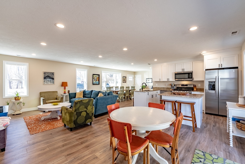 20 Ormond Drive Northampton, MA 01062 - Photo 12 of 32 a view of a dining room with furniture a rug and wooden floor