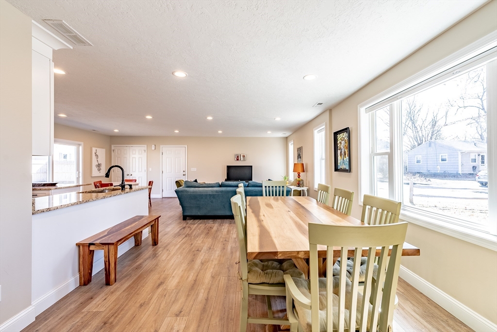 20 Ormond Drive Northampton, MA 01062 - Photo 13 of 32 a view of a dining room with furniture a kitchen and chandelier