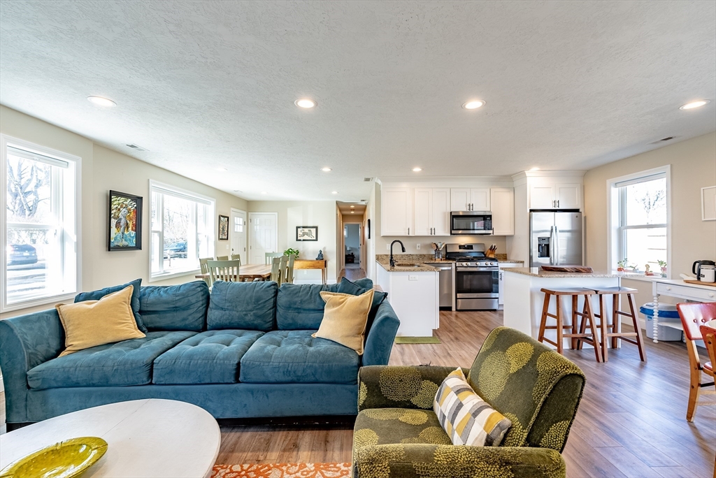 20 Ormond Drive Northampton, MA 01062 - Photo 2 of 32 a living room with furniture wooden floor and a kitchen view