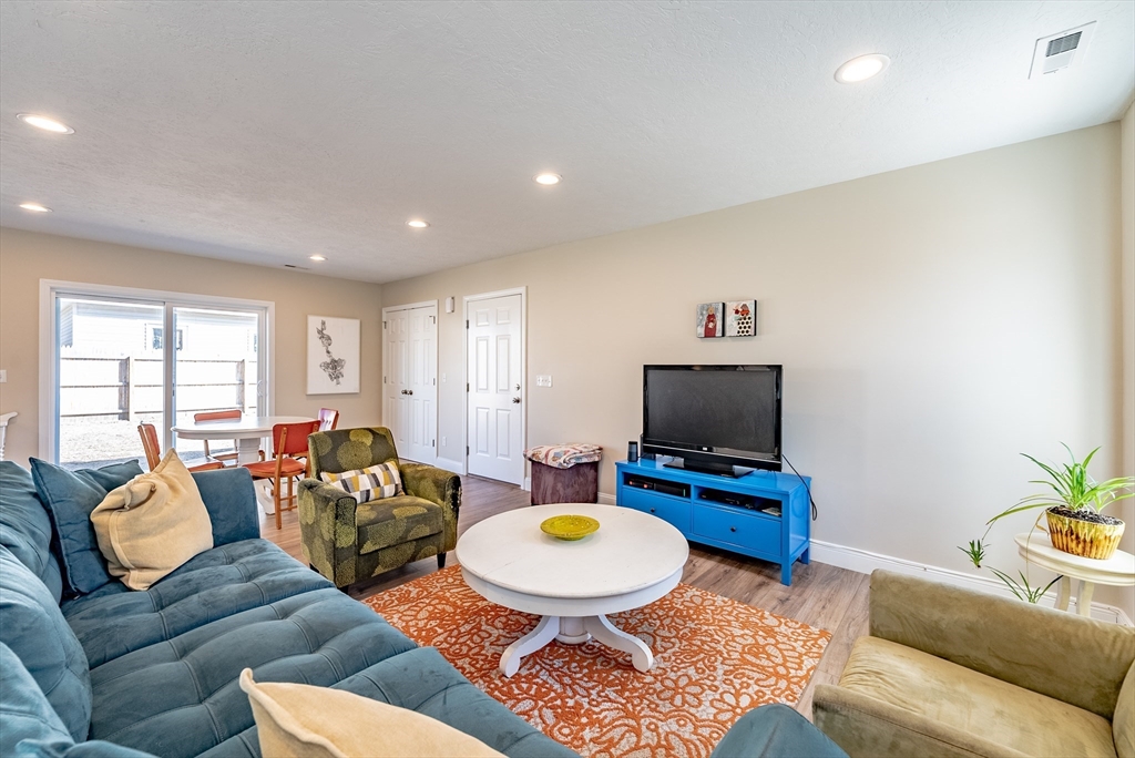 20 Ormond Drive Northampton, MA 01062 - Photo 4 of 32 a living room with furniture and a flat screen tv