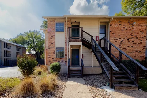 a view of entryway with wooden stairs