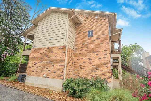 a view of a swimming pool with a lounge chairs