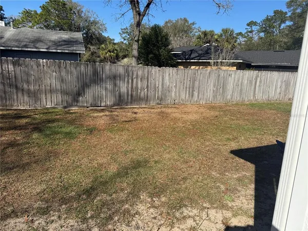 a view of a backyard of the house