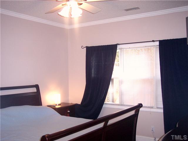 4020 Beaufain Street Raleigh, NC 27604 - Photo 7 of 10 a bed room with a window