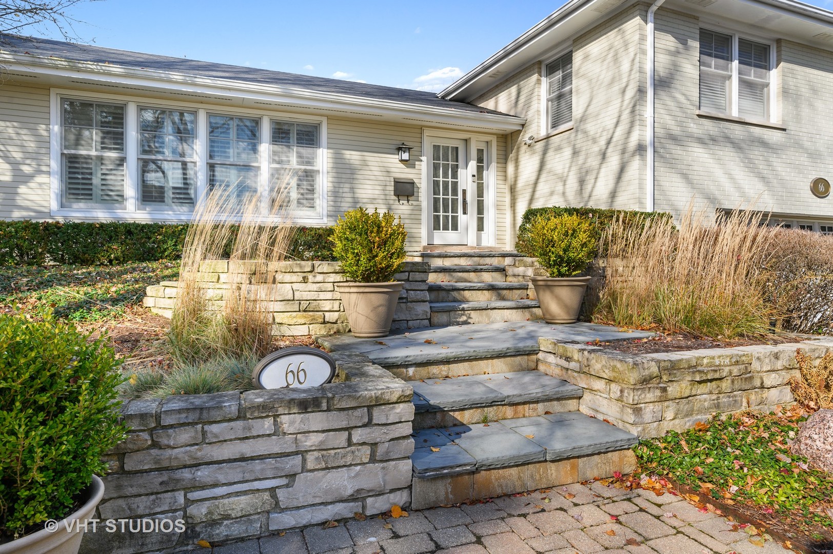 66 Meadowview Road Northfield, IL 60093 - Photo 3 of 33 a front view of a house with garden