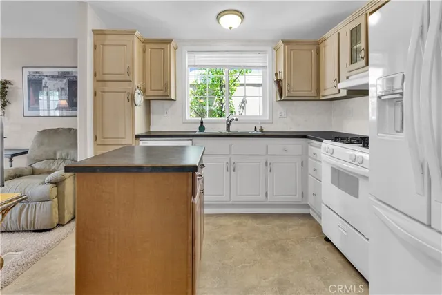 a kitchen with cabinets and window