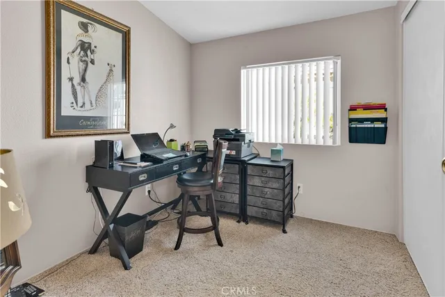a work room with furniture and windows