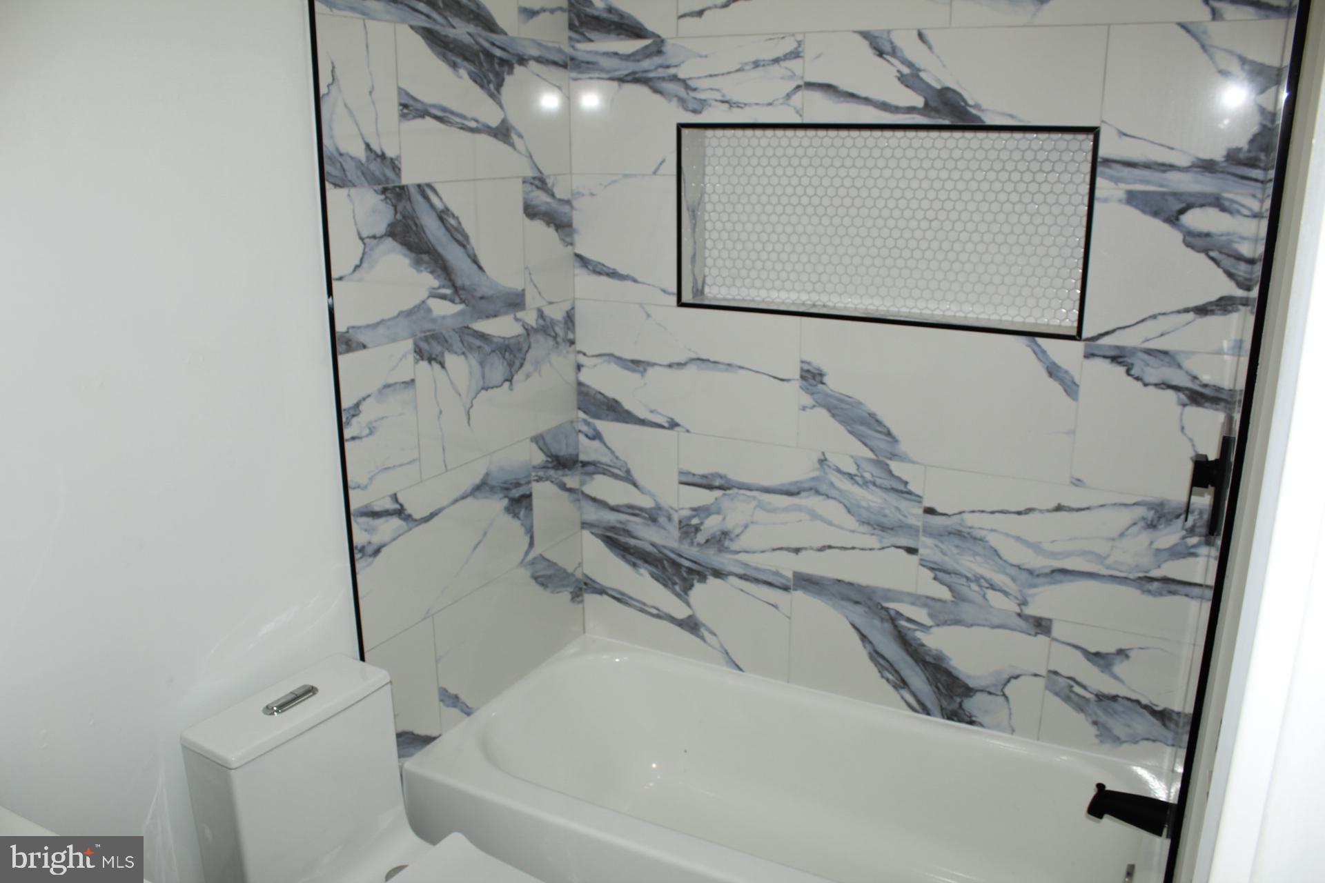 3017 Ridge Avenue, Unit C Philadelphia, PA 19121 - Photo 17 of 27 Elegant bathroom with marble accents.