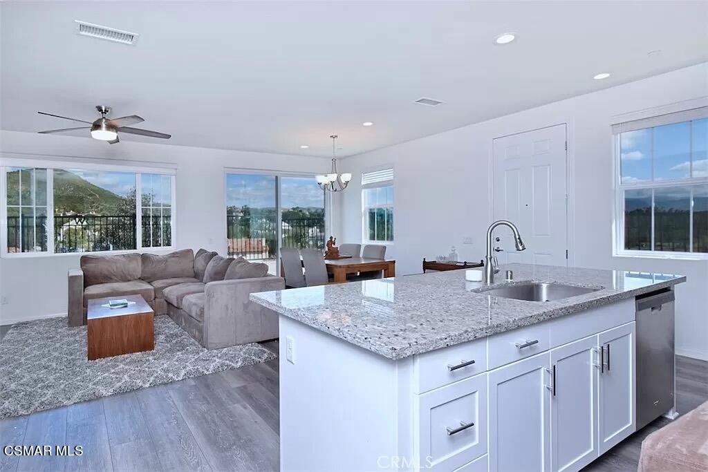 207 Morro Way, Unit 3 Simi Valley, CA 93065 - Photo 7 of 31 a view of kitchen island with granite countertop living room