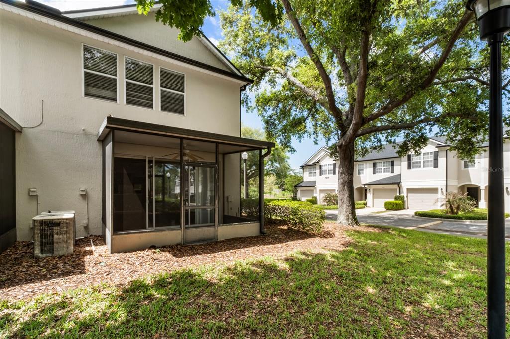 3151 Sinclair Street, Unit 101 Orlando, FL 32835 - Photo 16 of 18 front view of a house with a yard