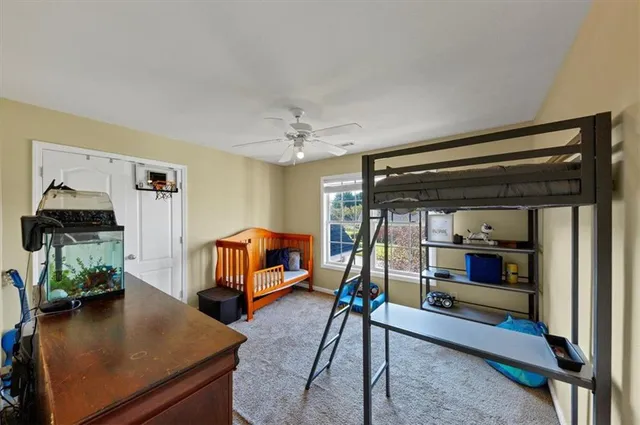 a bedroom with furniture and a mirror