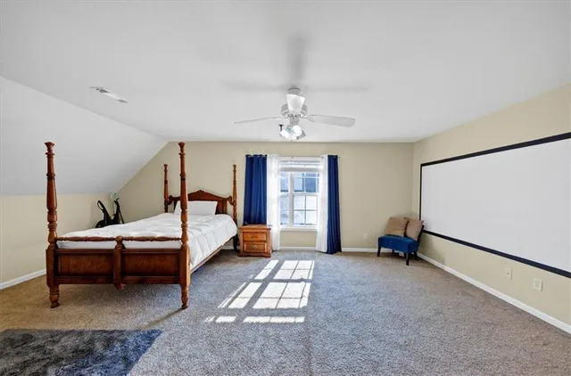 a bedroom with furniture and window