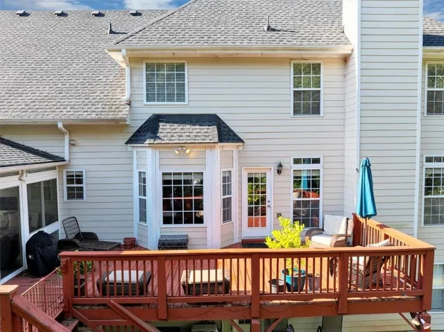 a view of a wooden chairs and a window