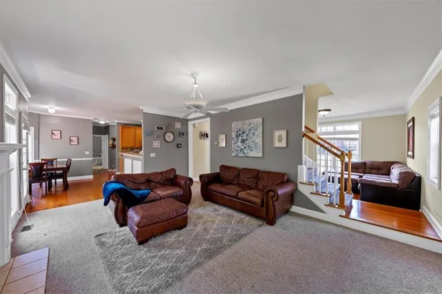 a bedroom with furniture and a large window