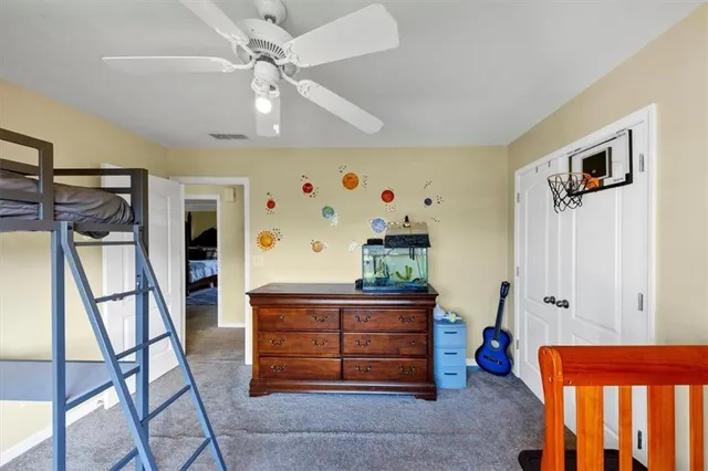 a view of a room with toys and a ceiling fan