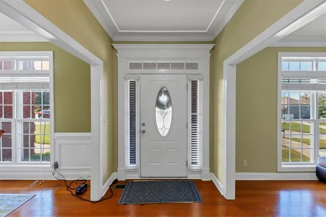 a view of room with furniture and wooden floor