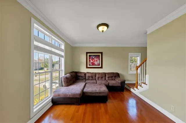 a bedroom with furniture and a window