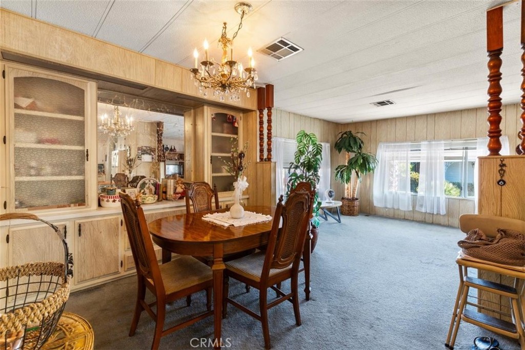 300 North Rampart Street, Unit 42 Orange, CA 92868 - Photo 14 of 37 Virtually Staged: Well Lit Dining Area