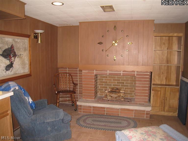 5015 North Sedgewick Road Cleveland, OH 44124 - Photo 15 of 15 Decorative fireplace gives a cozy feel to the room.