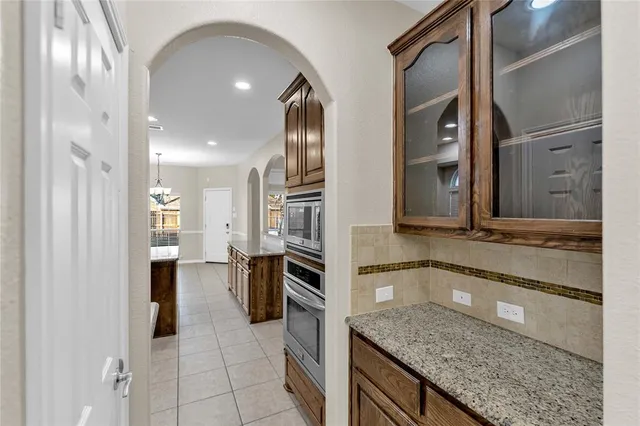a view of an empty room with a ceiling fan
