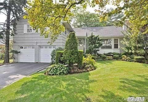 1260 Harbor Road Hewlett Harbor, NY 11557 - Photo 1 of 1 a view of a house with a yard