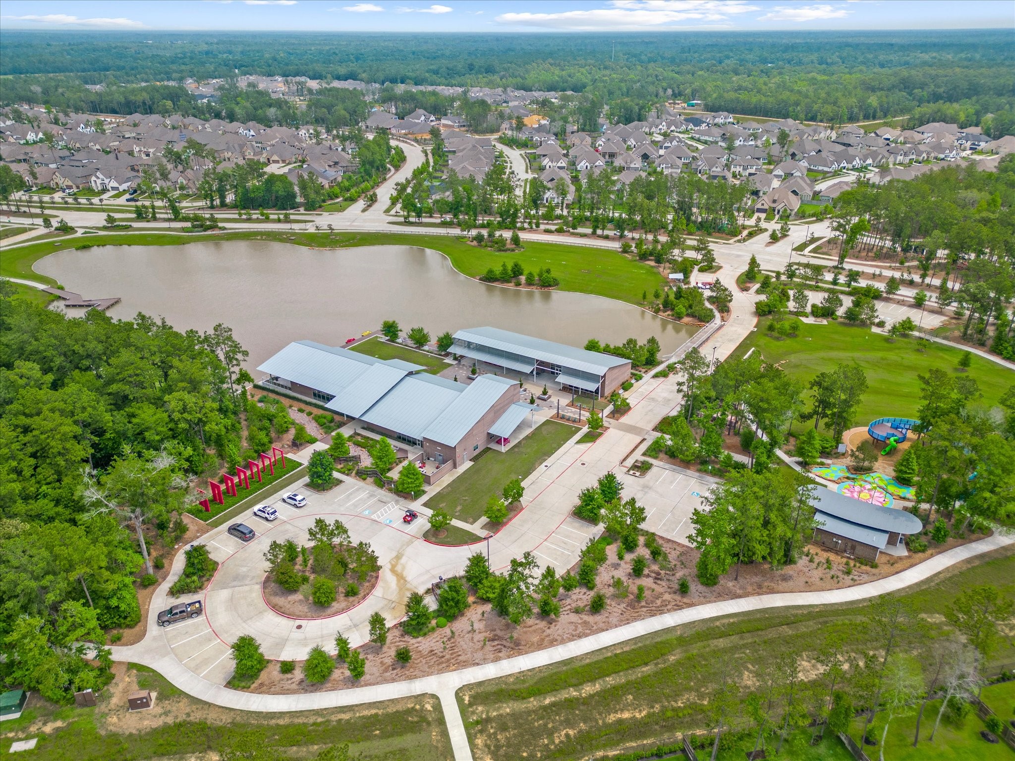 15520 Sunset Maple Court Conroe, TX 77302 - Photo 43 of 46 an aerial view of a house with a lake view