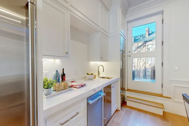 a hallway with a sink and a window
