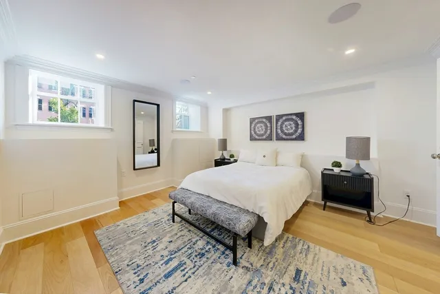 a spacious bedroom with a bed and a table