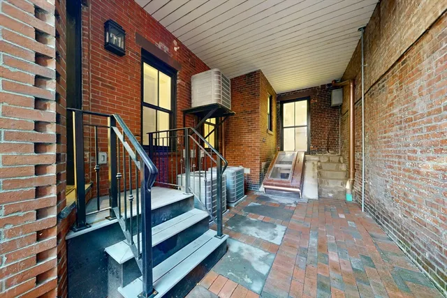 a view of entryway with wooden floor