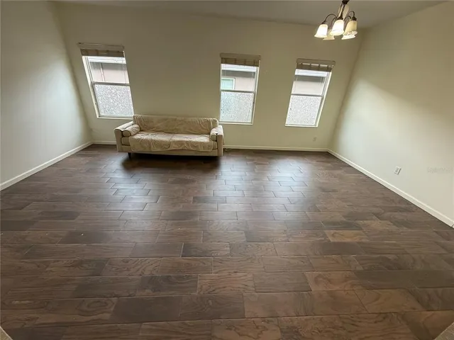 a view of a livingroom with furniture nad wooden floor