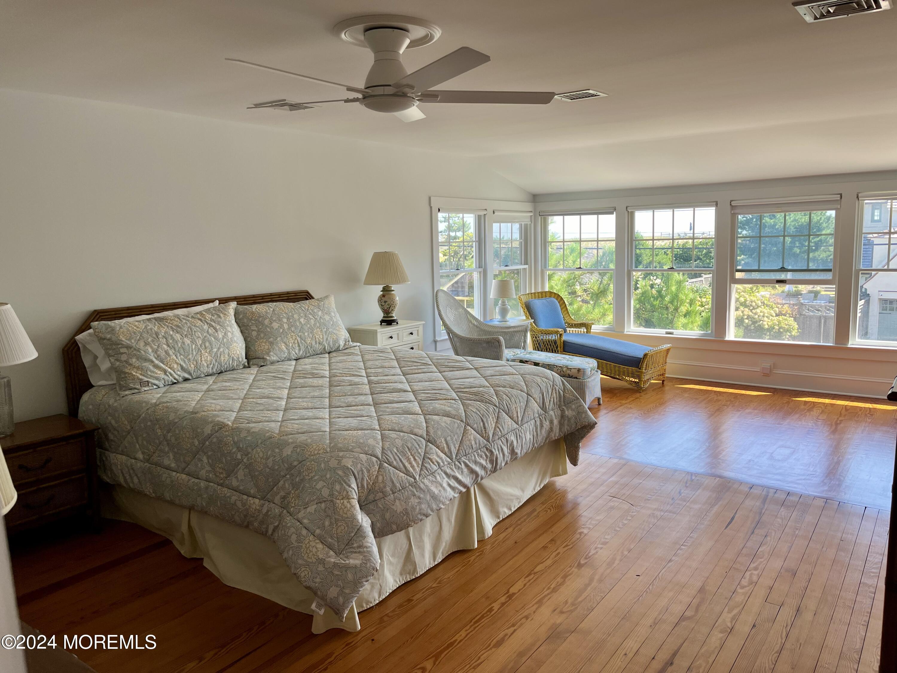 724 East Avenue, Unit SUMMER Bay Head, NJ 08742 - Photo 14 of 16 a bedroom with a large bed and a large window