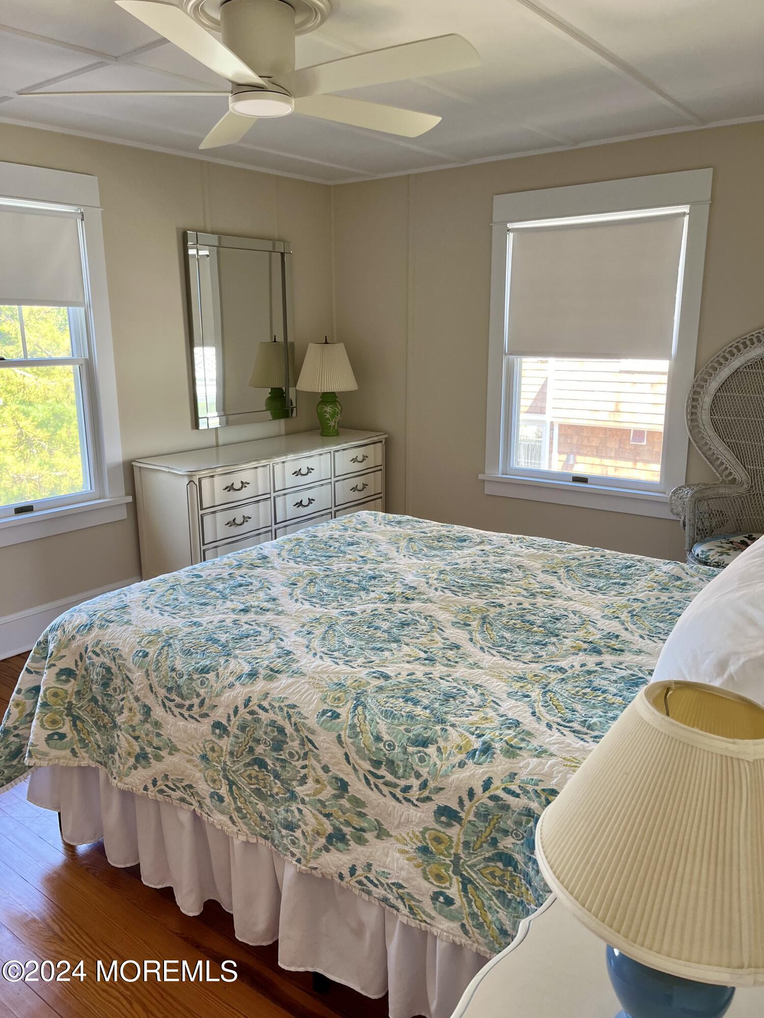 724 East Avenue, Unit SUMMER Bay Head, NJ 08742 - Photo 15 of 16 a bedroom with a bed and a window