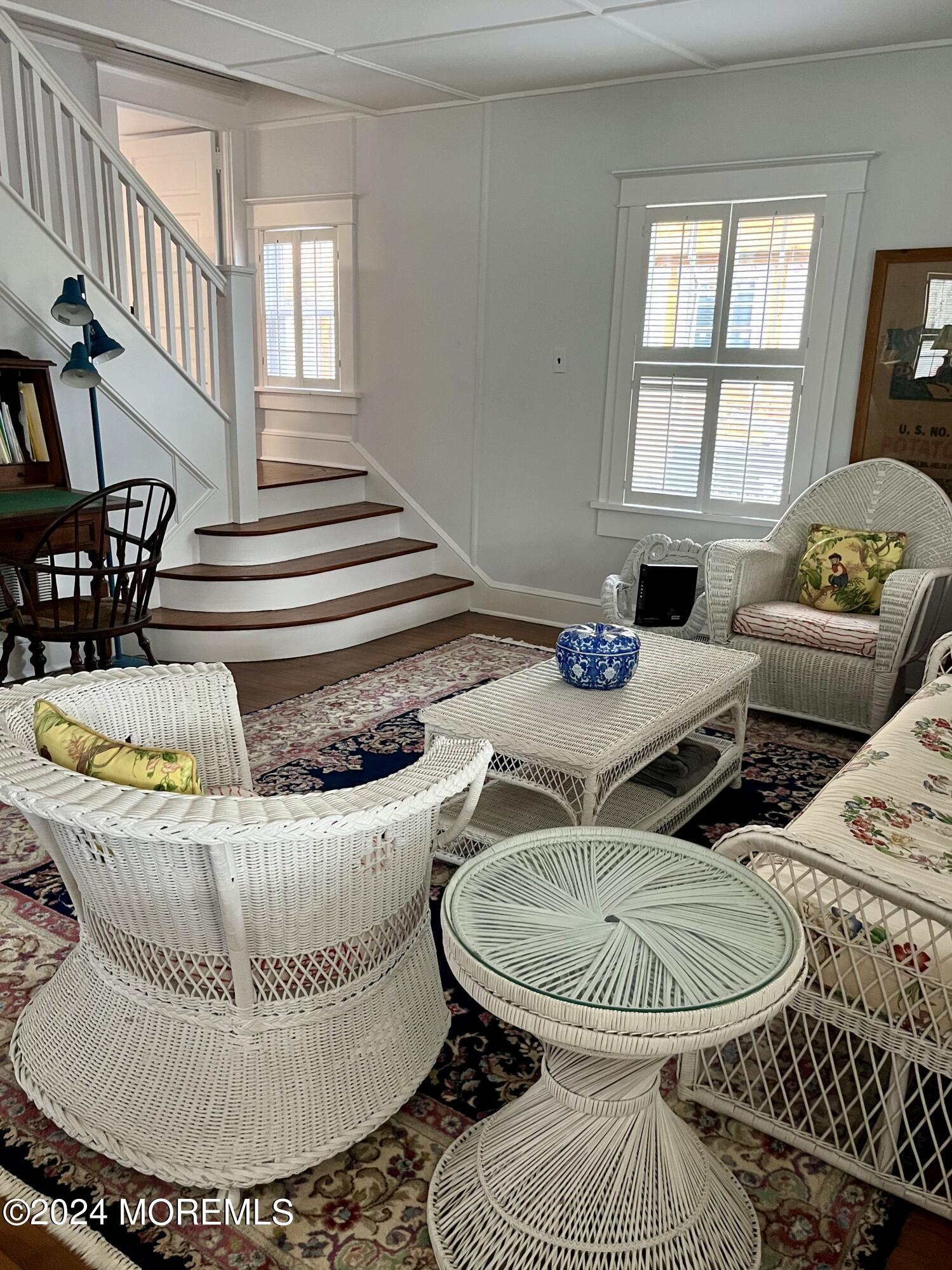724 East Avenue, Unit SUMMER Bay Head, NJ 08742 - Photo 6 of 16 a table with glass top table and chairs