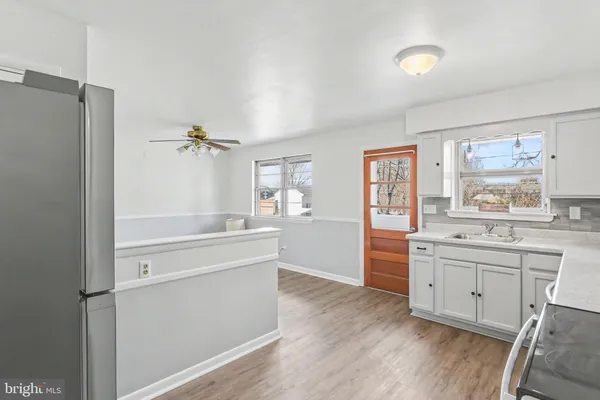 a room with a wooden floor and window