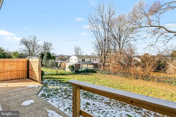 a view of a yard and front view of a house