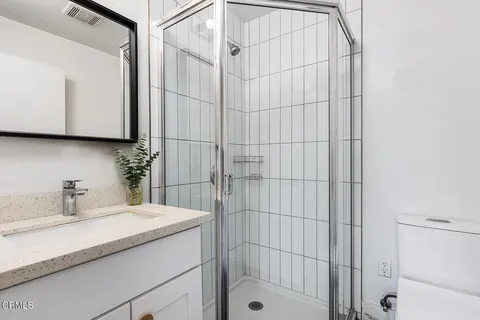 a bathroom with a sink and a shower