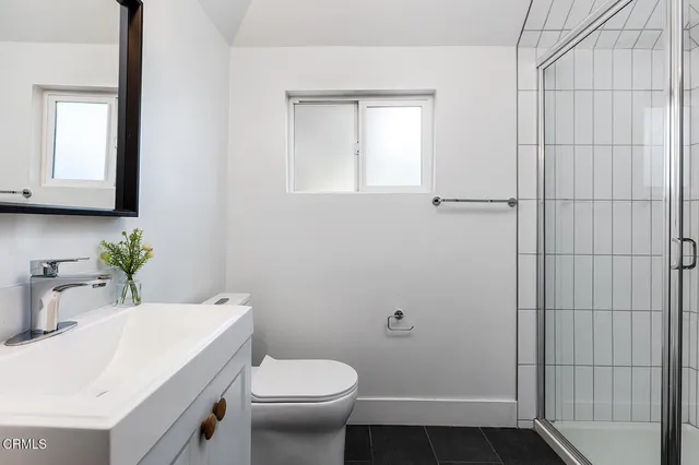 a bathroom with a sink toilet and vanity