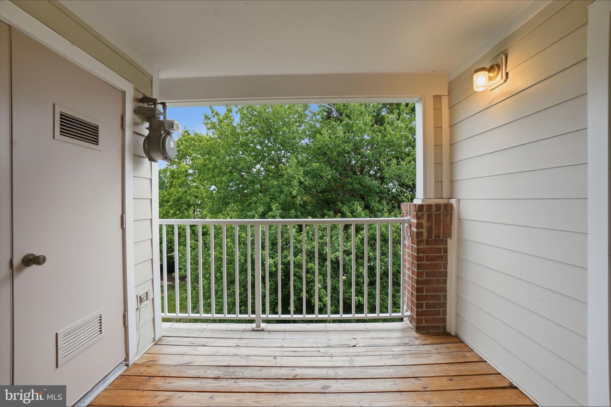 20960 Timber Ridge Terrace, Unit 303 Ashburn, VA 20147 - Photo 20 of 32 Balcony with wooded views