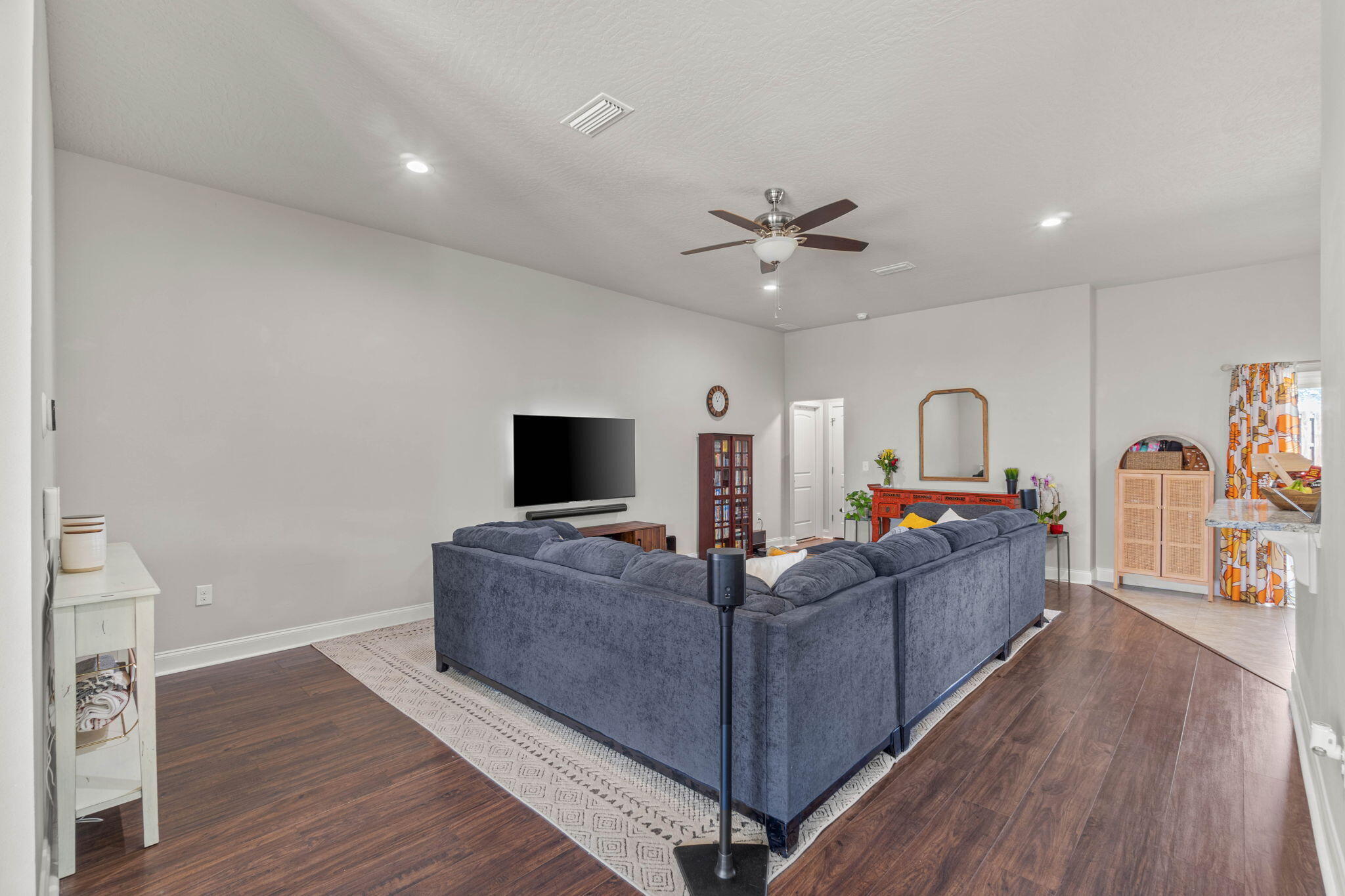 4746 Chanson Crossing Crestview, FL 32539 - Photo 5 of 21 a living room with furniture and a flat screen tv