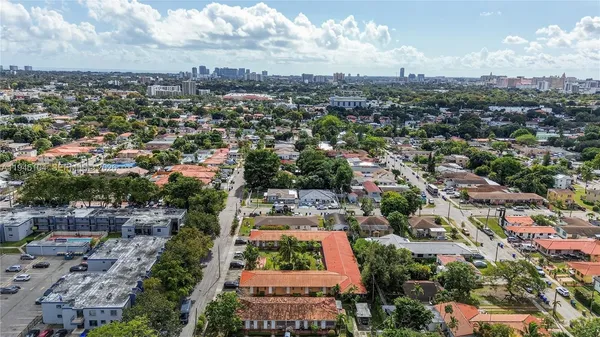 an aerial view of residential building and green space