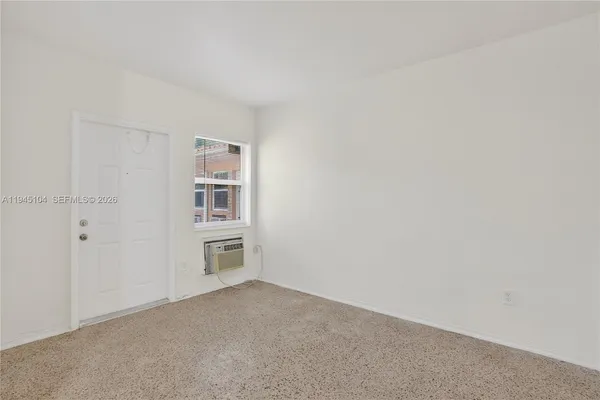 a big room with closet and windows