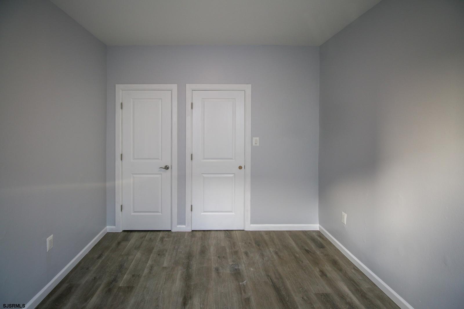 225 Atlantic Avenue, Unit B7 Atlantic City, NJ 08401 - Photo 21 of 28 a view of an empty room with wooden floor and closet